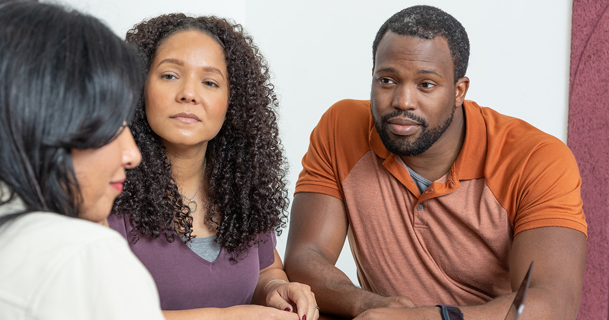 Three African-American business owners are discussing their company's retirement program from TruStage™