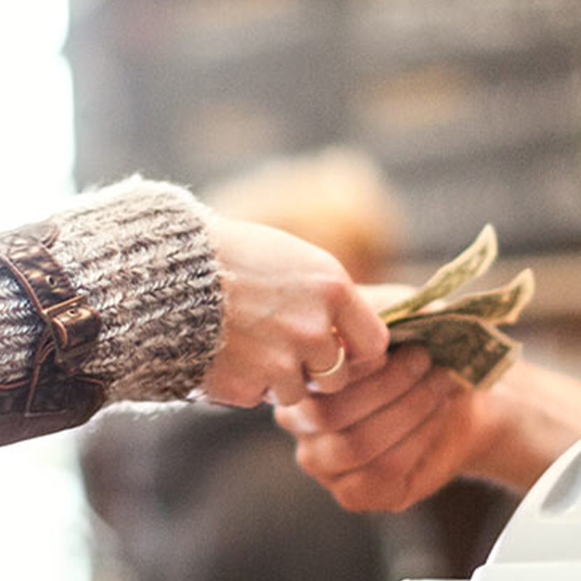 Hands exchanging cash
