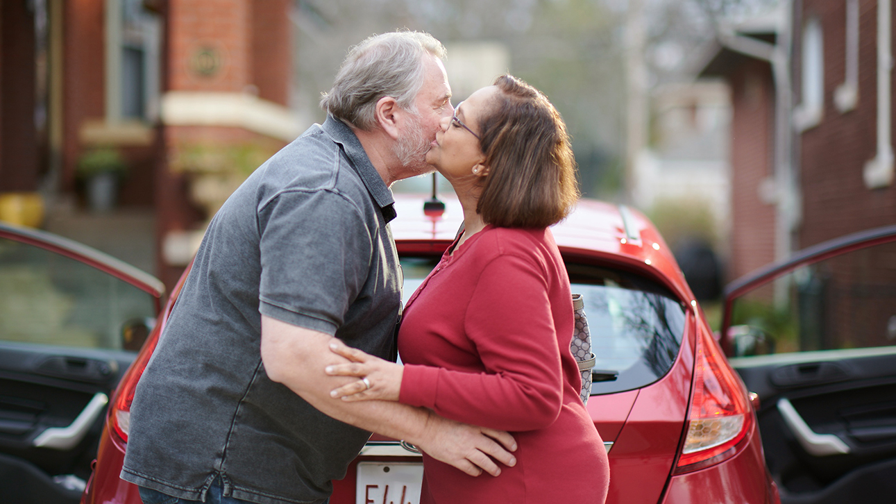Man and woman embracing to celebrate the performance of their Single Premium Immediate Annuity performance