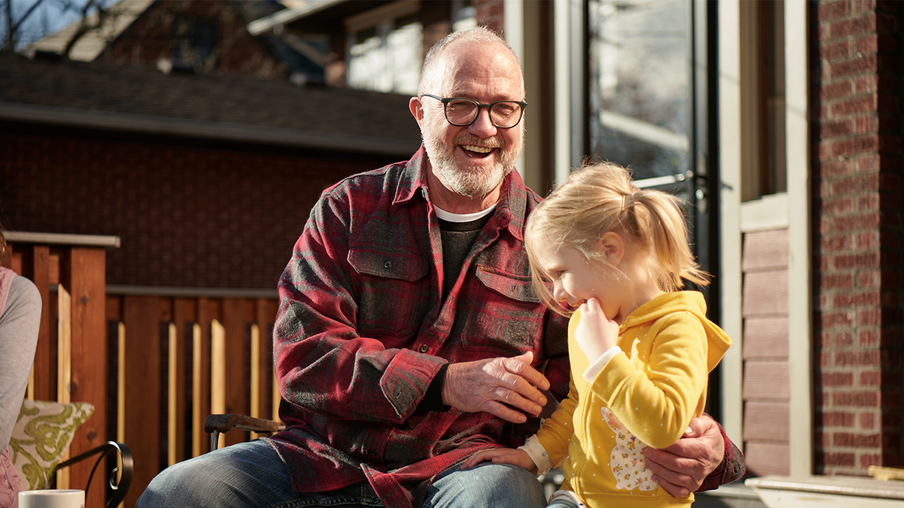 Grandfather laughing while explaining Zone Choice annuities to his granddaughter